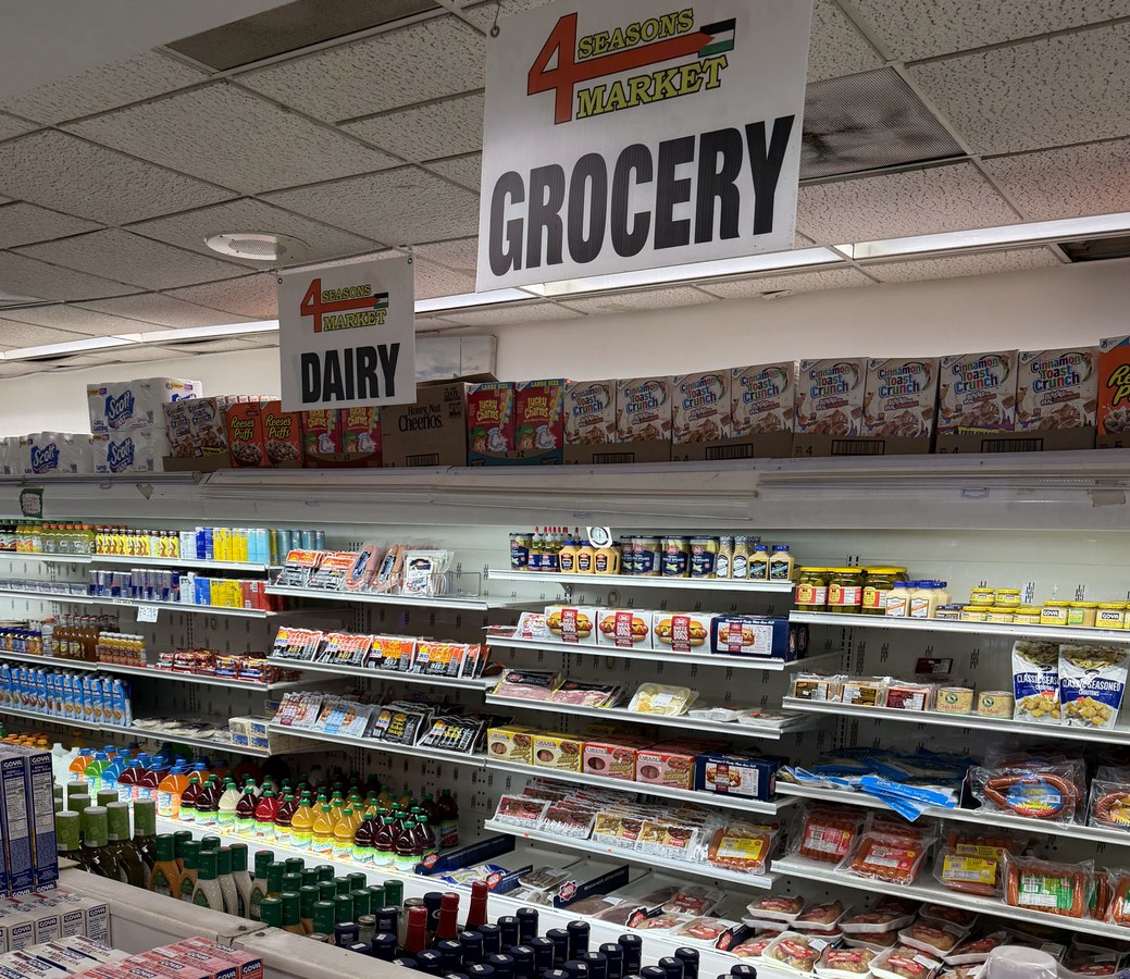 Grocery aisle with 4 Seasons Market sign
